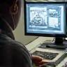 Technician working on photo digitalization.